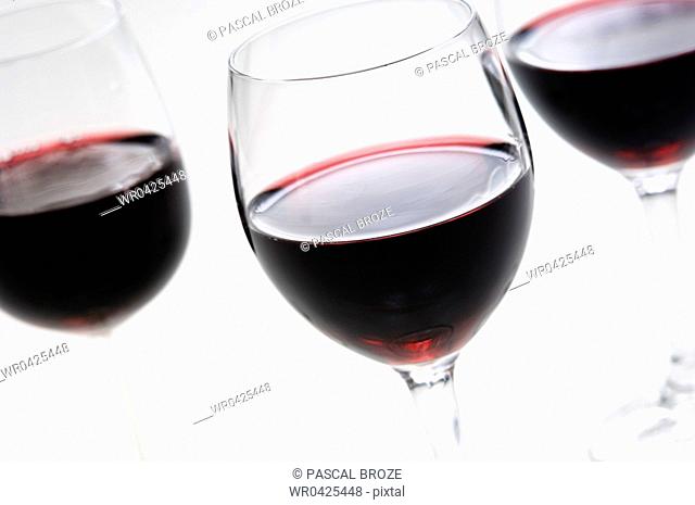 Close-up of three glasses of red wine