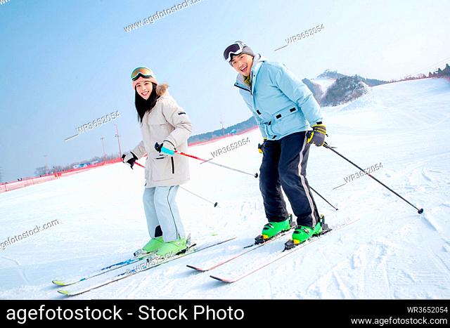 Happy young couples in the ski resort