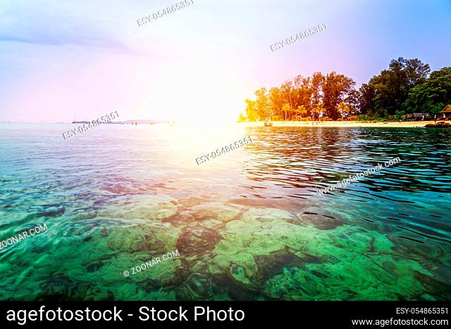 Beautiful nature landscape colorful the sunlight at the sunrise in summer over the clear sea, see the coral reef, beache, tree, resort at North Point Beach
