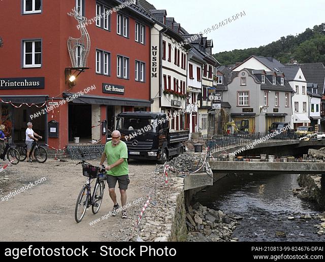 12 August 2021, North Rhine-Westphalia, Bad Münstereifel: Debris and destroyed streets one month after the flood disaster in the Eifel village on the banks of...
