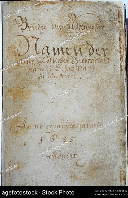 27 July 2022, Rhineland-Palatinate, Mainz: The title page of the historical book of souls of the St.-Sebastianus-Bürger-Schützengesellschaft Ahrweiler