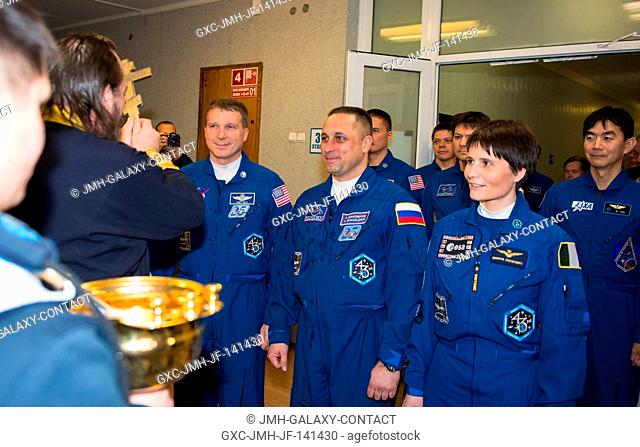 Expedition 42 Flight Engineer Terry Virts of NASA, left, Soyuz Commander Anton Shkaplerov of the Russian Federal Space Agency (Roscosmos), center