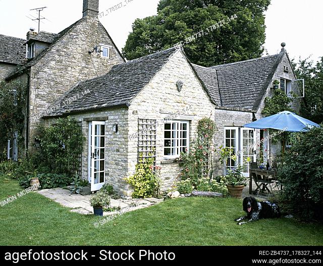 Back garden of cottage with french windows