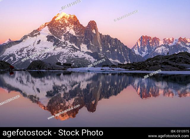 Evening atmosphere with alpenglow, water reflection in Lac Blanc, mountain peaks, Aiguille Verte, Grandes Jorasses, Aiguille du Moine, Mont Blanc