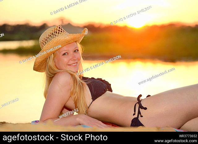 Young woman with a bikini lying on a beach