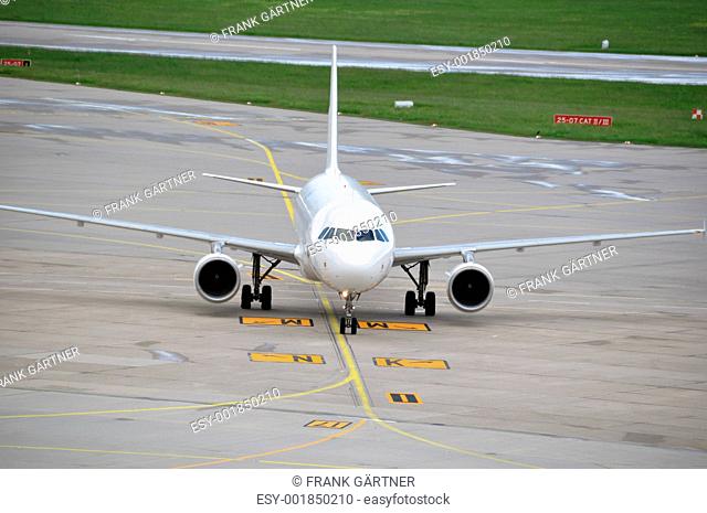 Airplane taxiing at large airport