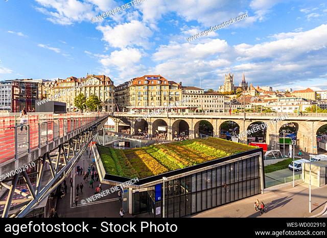 Switzerland, Lausanne, cityscape with train station, bridge Grand-Pont and cathedral Notre-Dame