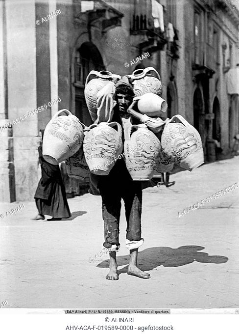Seller of terracotta pots called quartare on a street in Messina, shot 1915-1920 ca. by Alinari, Fratelli