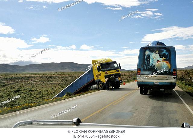 Accident on a highway and buses with a religious picture, Jesus as Lord of the world, Bolivian Altiplano highlands, Departamento Oruro, Bolivia, South America