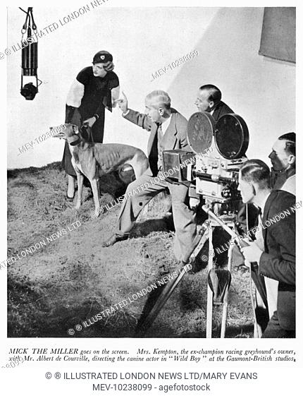 Mrs Arundel Kempton, owner of the ex-champion greyhound Mick the Miller is pictured with Mr Albert de Courville who is directing the doggy star in the...