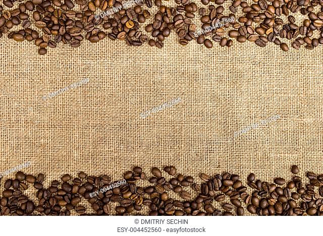 Coffee beans and sackcloth background