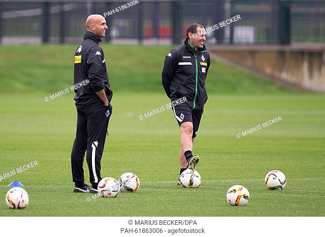 Moenchengladbach's caretaker coach Andre Schubert (L) talks to assistant coach Manfred Stefes during a training session of German Bundesliga soccer club...