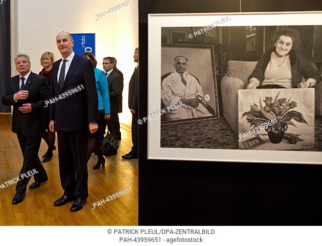 Federal President Joachim Gauck (L) and the Premier of Brandenburg Dietmar Woidke (3rd from L) stand in the exhibition of the Israeli holocaust memorial Yad...