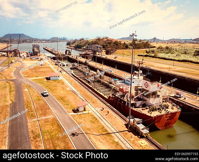 Panama City, Panama - march 2018: Cargo Ships crossing the Panama Canal, Miraflores Locks, Panama City