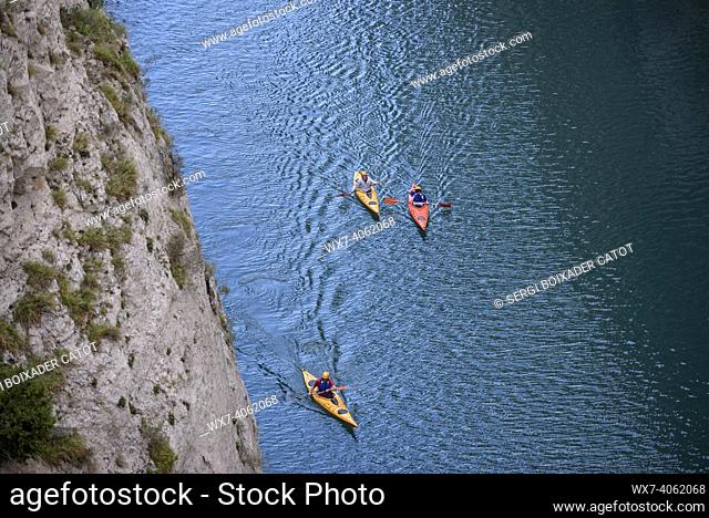 Congost de Mont-rebei gorge, in the Montsec mountain range, with some kayaks on the Noguera Ribagorzana river (Lleida province, Catalonia, Spain, Pyrenees)