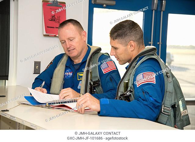 NASA astronaut Barry Wilmore (left), Expedition 41 flight engineer and Expedition 42 commander; and NASA astronaut Michael Hopkins