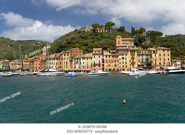 View of Portofinos Riviera di Levante and its colorful buildings and harbor, a small Italian fishing village in the province of Genoa on the Italian Riviera on...