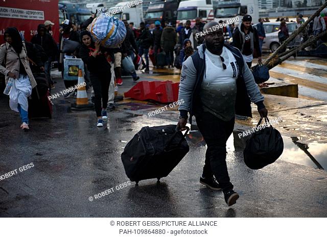 Refugees from Moria Camp reach habour of Piraeus. Greece's immigration authorities ferry asylum seekers from Moria Camp on Lesvos island to more suitable...