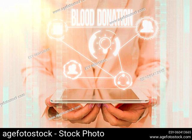 Conceptual caption Blood Donation, Concept meaning Process of collecting testing and storing whole blood Lady In Uniform Touching And Using Futuristic...
