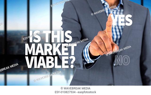 Composite image of focused businessman pointing