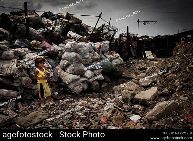 Little boy collecting rubbish on Smokey Mountain