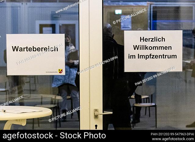 02 December 2020, Schleswig-Holstein, Gettorf: Participants of a press conference are standing in a multipurpose hall in Gettorf in the district of...