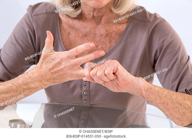Senior woman suffering from hand pain