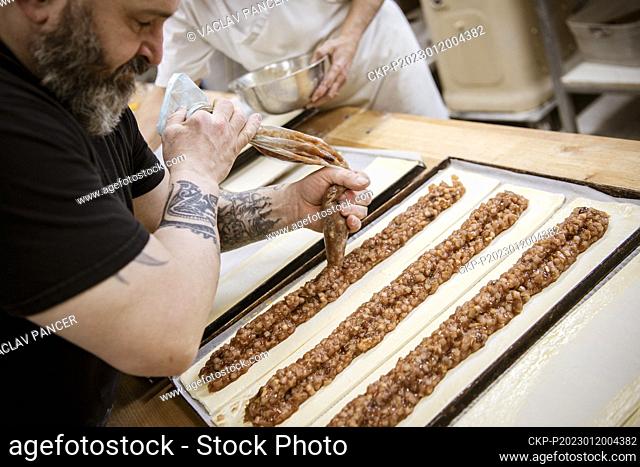 Baker Jan Hanzl prepares Apple pie (strudel) in his bakery in Vimperk, Czech Republic, January 19, 2023. (CTK Photo/Vaclav Pancer)