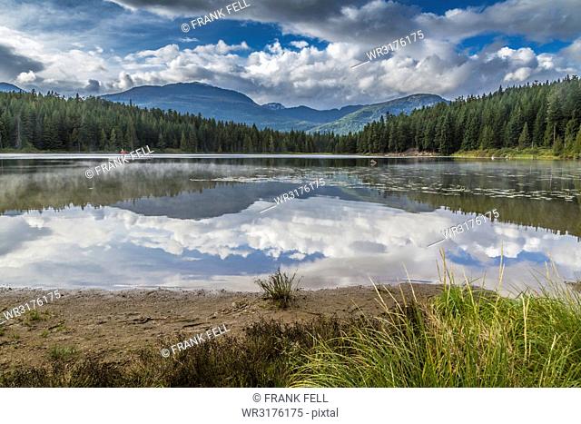Mist on Lost Lake, Ski Hill and surrounding forest, Whistler, British Columbia, Canada, North America