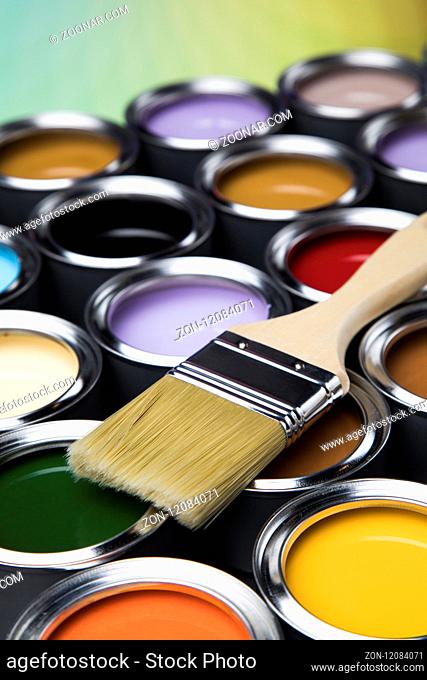 Tin metal cans with color paint and paintbrush