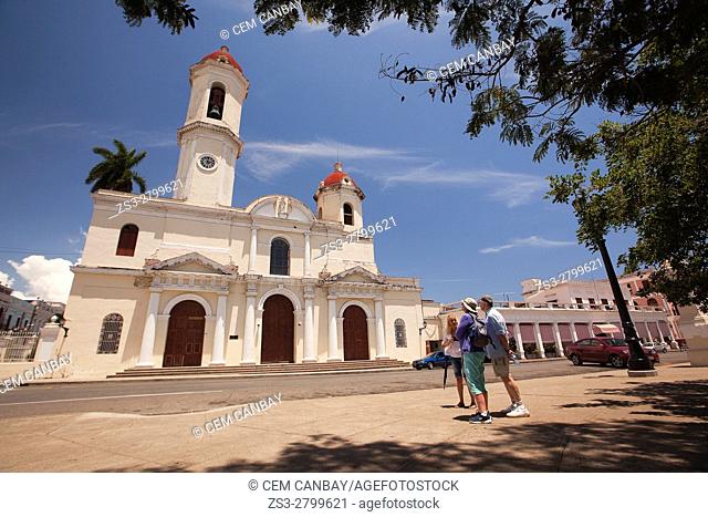 Guide with tourists in front of the Purisima Concepcion Cathedral near Jose Marti Park, Cienfuegos, Cuba, West Indies, Central America