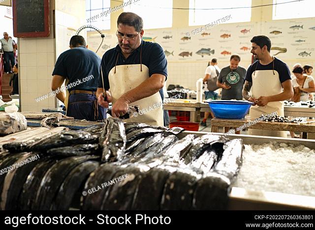Fish processing in the farmer’s market (Mercado dos Lavradores) in Funchal on the Portugese island Madeira on July 22, 2022
