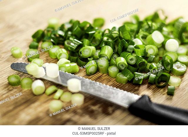 Knife with chopped green onions
