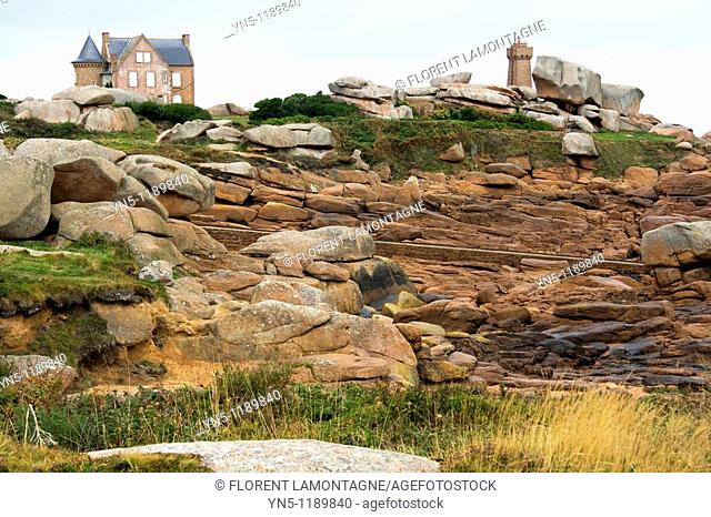 France, Bretagne province, Departement of Cote d'Armor 22, Ploumanach   Beautiful site with old houses, lighthouse and a path along the coast made of rose...