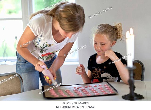 Sisters baking cookies