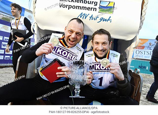 Patrick Lehmann (L) and Robert Ninas are the winners of the 20 Beach Chair Sprinting World Cup's 20 metre discipline in Ahlbeck, Germany, 27 January 2018