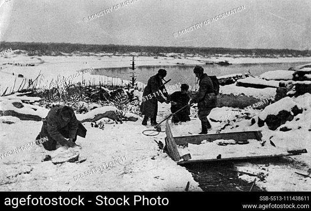 Russian Front Winter 1943 -- Sappers cleaning a road of mines under arctic conditions. May 17, 1943. (Photo by Ministry of Information)