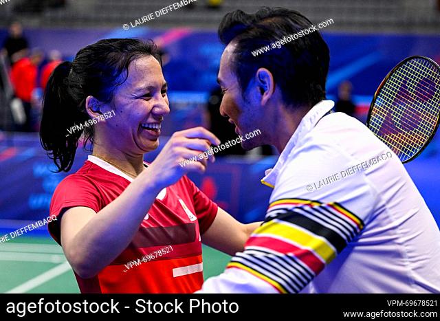 Badminton player Lianne Tan and Badminton Coach Indra Chandra celebrate after winning a match in the round of 16 of the women's singles competition badminton