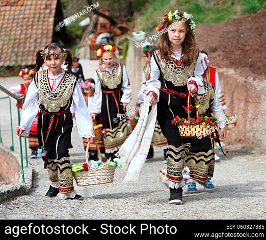 Gara Bov, Bulgaria- April 24, 2021: The girls decorate in a colorful and rich way their hairs and go around the village, singing songs and dancing