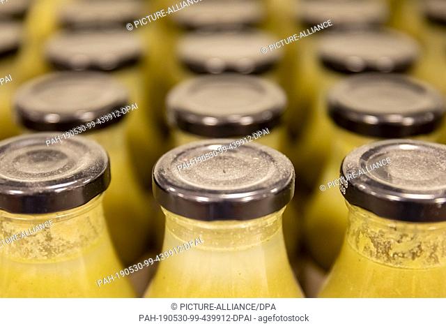09 May 2019, Berlin: Dusty lids on bottles of vegetable soup can be seen in a branch of the supermarket ""SirPlus"" for expired and leftover food in...