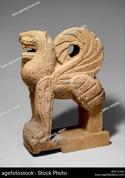 Nenfro statue of a winged lion. Period: Archaic; Date: ca. 550 B.C; Culture: Etruscan; Medium: Nenfro; Dimensions: H. 37 1/2 in. (95