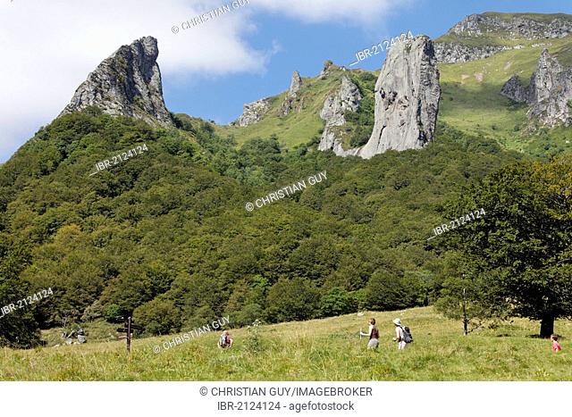 Hikers in Chaudefour Valley natural reserve, Parc Naturel Regional des Volcans d'Auvergne, Auvergne Volcanoes Regional Nature Park, Puy de Dome, France, Europe