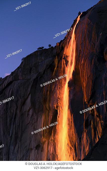 February setting sun reflects off Yosemite's seasonal Horsetail Fall, giving a molten lava appearance