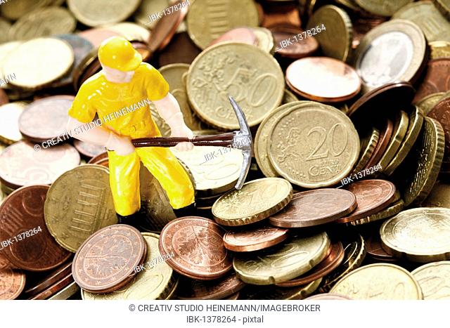 Figure of a construction worker with hard hat and pickaxe on Euro coins