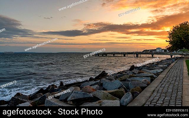 Sassnitz, Mecklenburg-Western Pomerania, Germany - October 02, 2020: Evening light over the Promenade and the pier