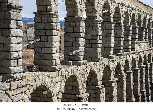 Tourist, Roman aqueduct of segovia. architectural monument declared patrimony of humanity and international interest by UNESCO