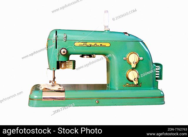 Old sewing machine Tula 1972 release in Russia isolated on white phone