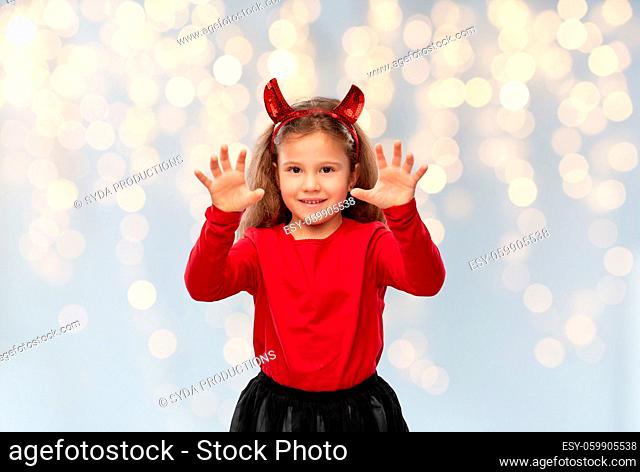 girl costume with devil's horns on halloween