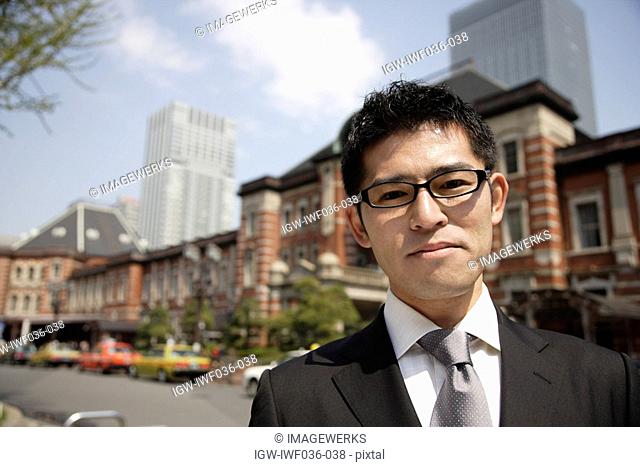 Portrait of a young businessman wearing glasses
