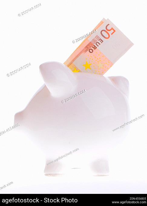 Saving fifty euro in a white money box